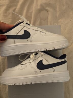 Nike White Low-Top Sneakers with Navy Swoosh